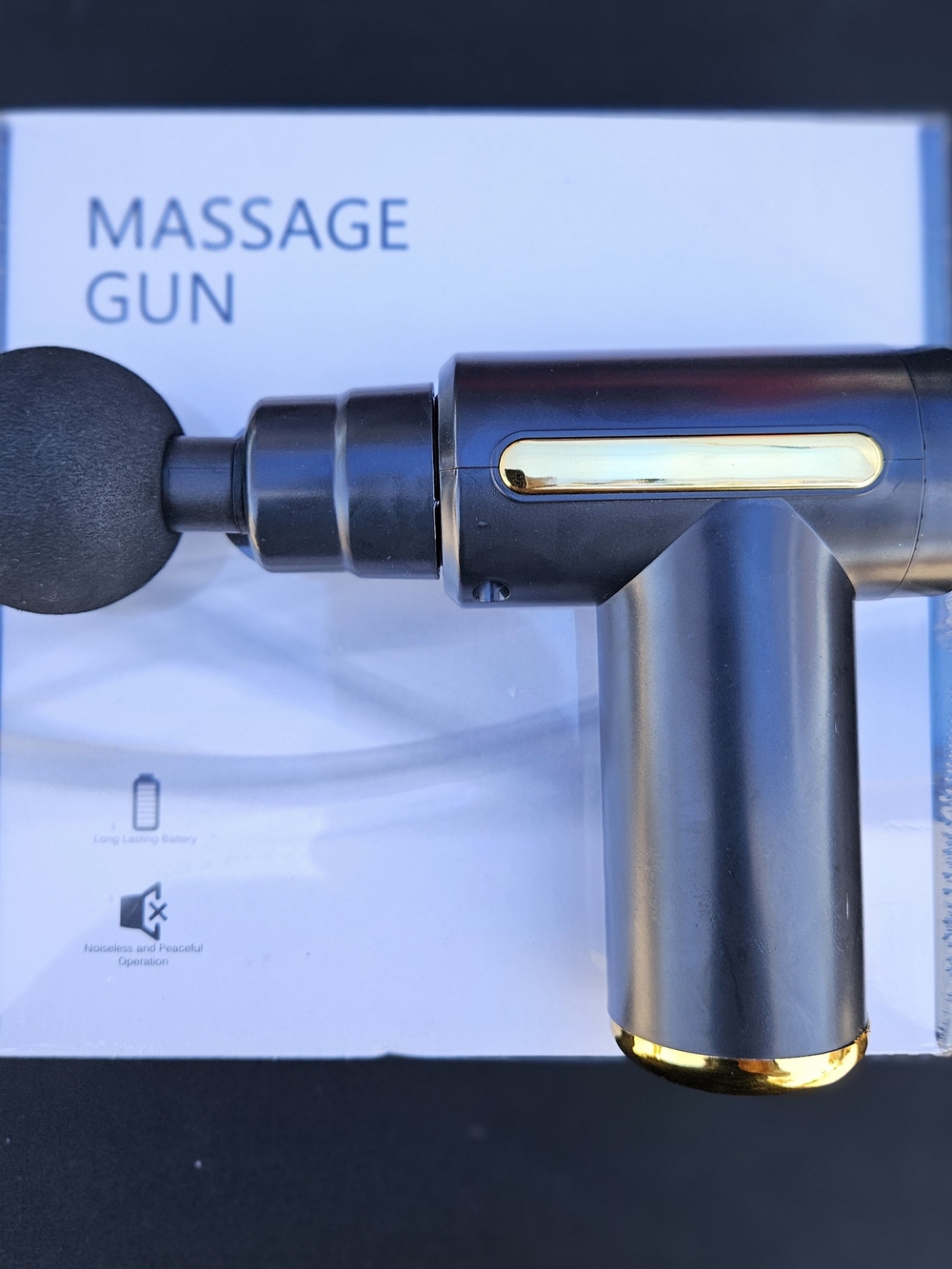 Black Massage Gun with Gold Accents